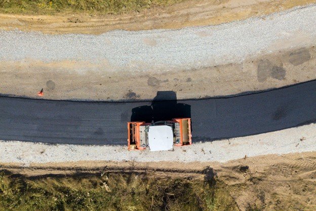 Large-scale concrete flatwork installation in progress at a commercial construction site in Frisco, TX