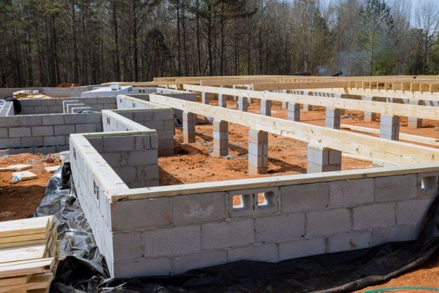 Concrete block foundation with floor framing system installed during new home construction in Strongsville, OH
